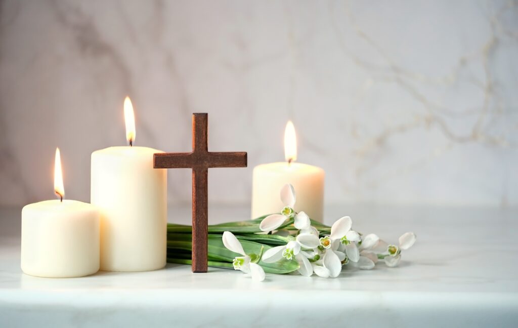 Wooden,Cross,,Snowdrops,Flowers,And,Candles,On,Table,,Abstract,Background.